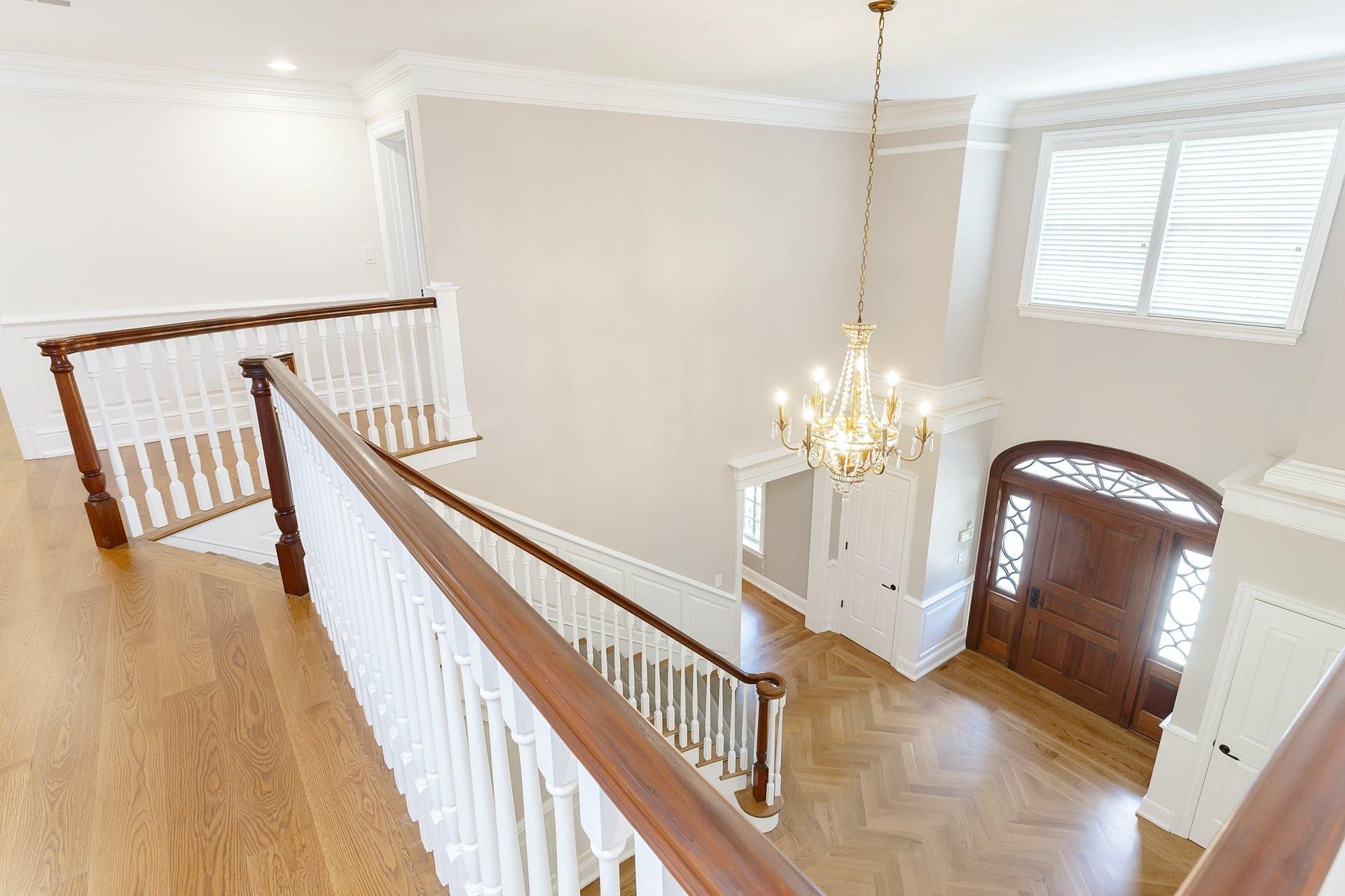 274 Mariomi Road New Canaan, CT 06840 - Photo 3 of 56 a view of a hallway with wooden floor windows and entryway