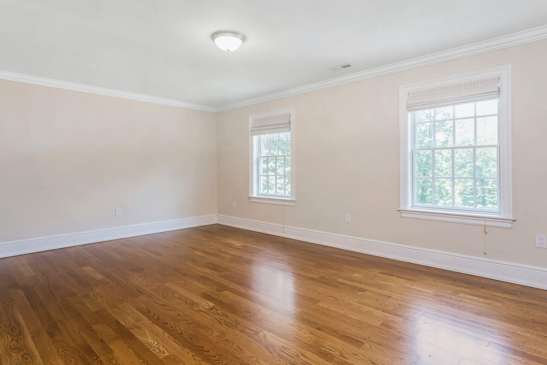 274 Mariomi Road New Canaan, CT 06840 - Photo 32 of 56 an empty room with wooden floor and windows