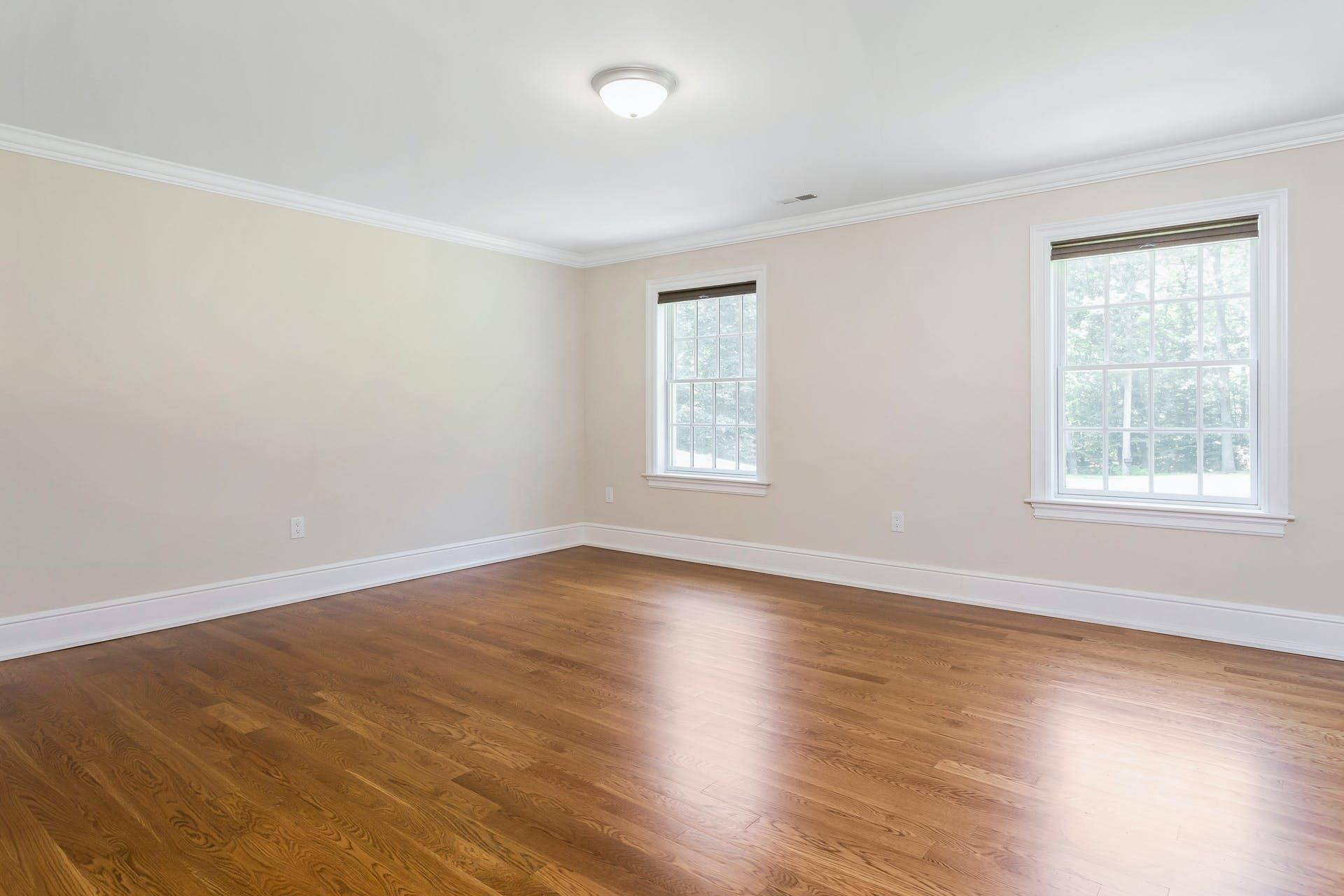274 Mariomi Road New Canaan, CT 06840 - Photo 33 of 56 a view of an empty room with wooden floor and a window