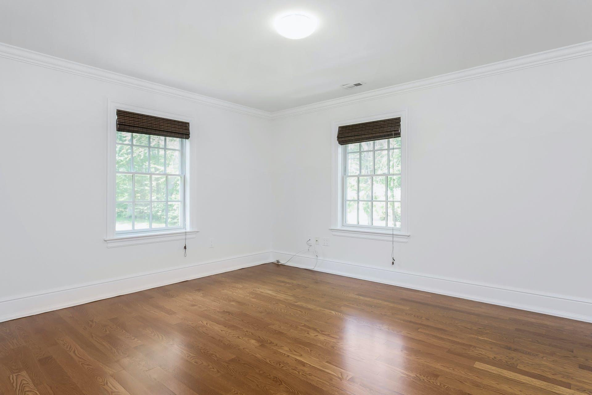 274 Mariomi Road New Canaan, CT 06840 - Photo 37 of 56 a view of an empty room with wooden floor and a window