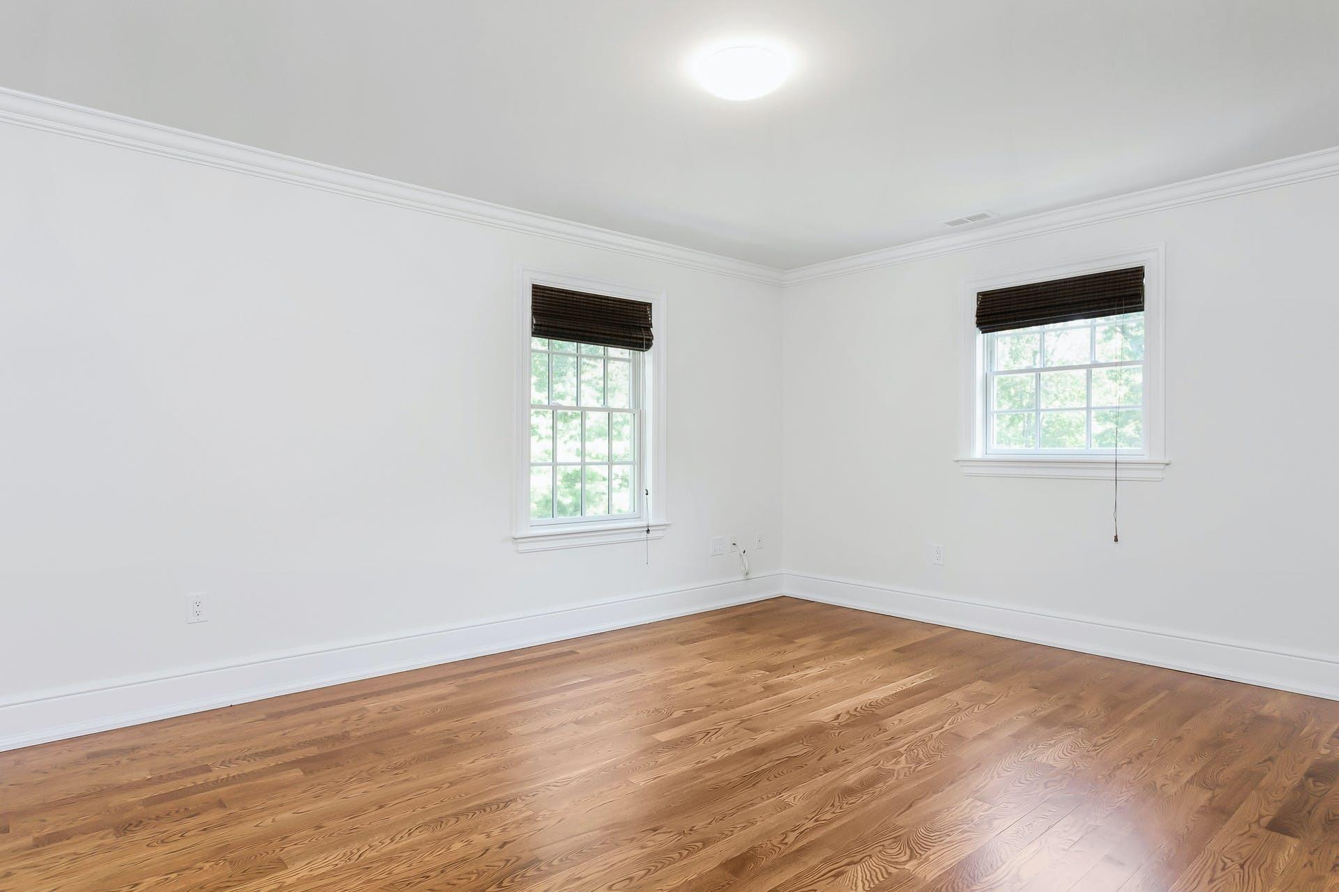 274 Mariomi Road New Canaan, CT 06840 - Photo 38 of 56 an empty room with wooden floor and windows
