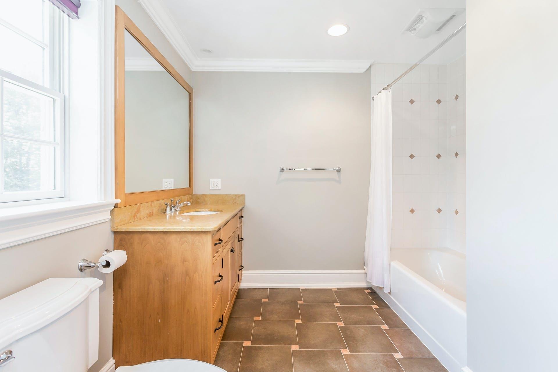 274 Mariomi Road New Canaan, CT 06840 - Photo 39 of 56 a bathroom with a sink a toilet and shower