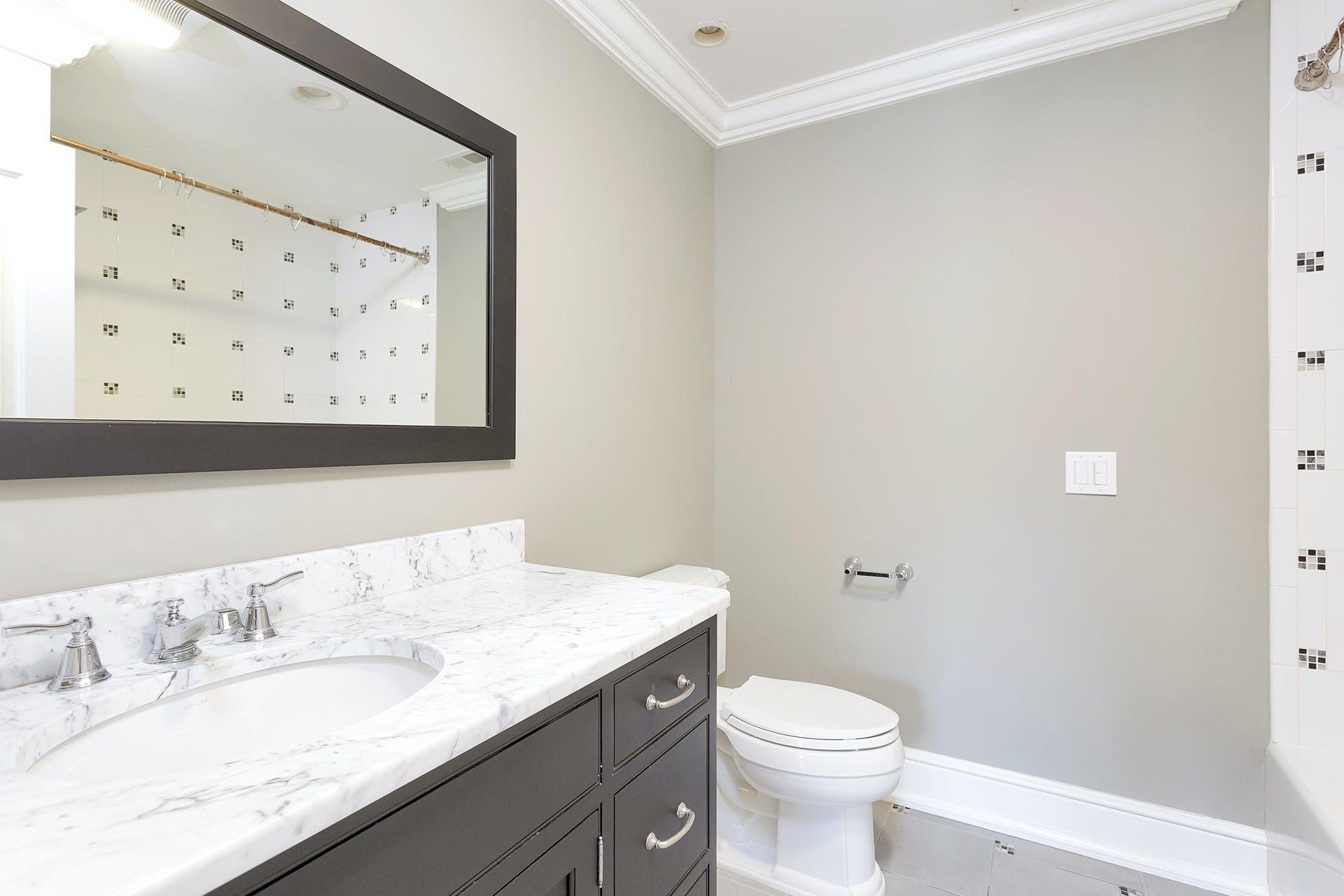 274 Mariomi Road New Canaan, CT 06840 - Photo 44 of 56 a bathroom with a granite countertop sink mirror vanity and toilet