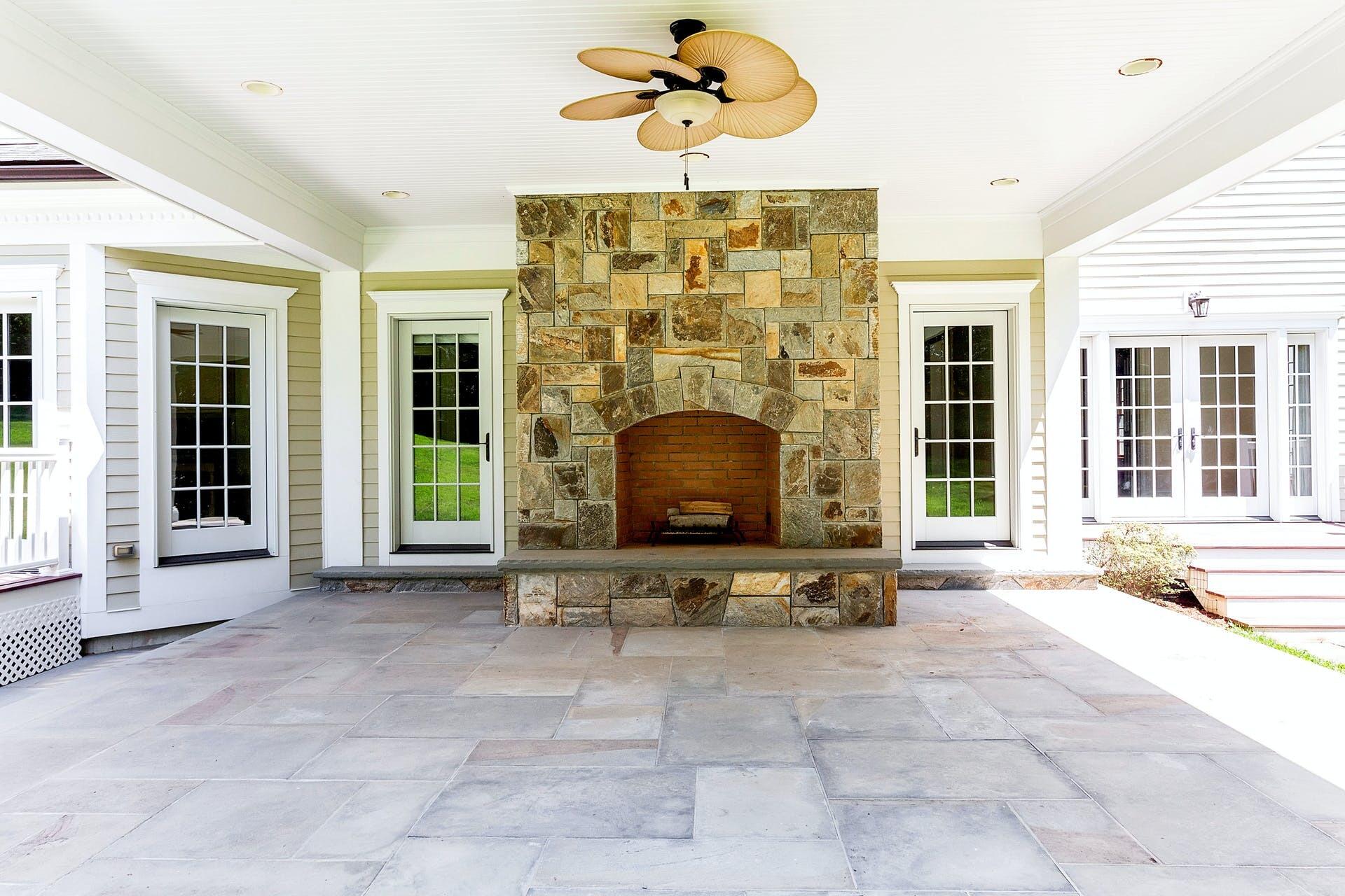 274 Mariomi Road New Canaan, CT 06840 - Photo 48 of 56 a building outdoor space with patio furniture and potted plants