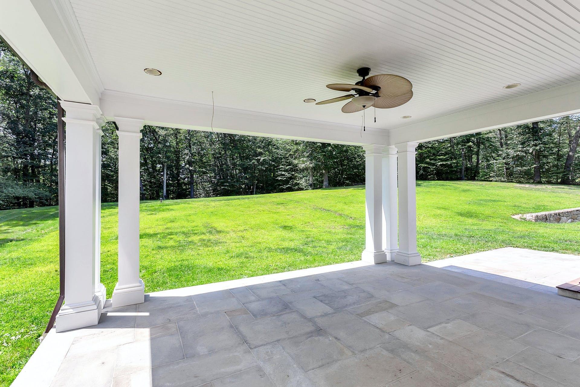 274 Mariomi Road New Canaan, CT 06840 - Photo 49 of 56 a view of a room with porch and a big yard