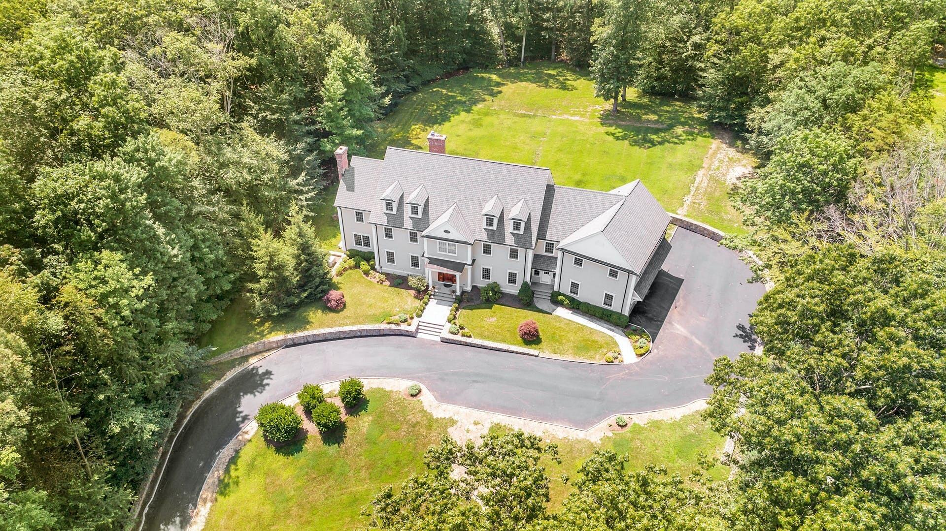 274 Mariomi Road New Canaan, CT 06840 - Photo 53 of 56 an aerial view of a swimming pool with yard