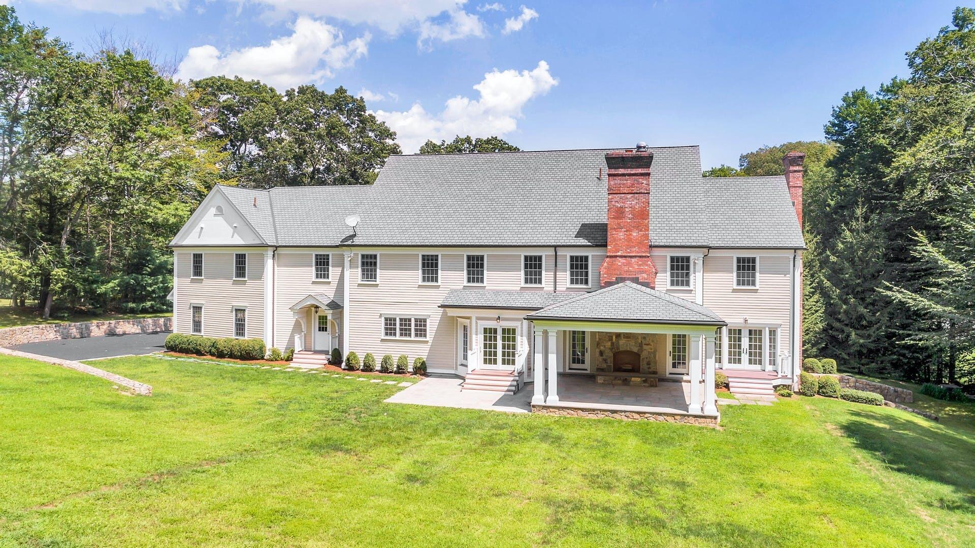 274 Mariomi Road New Canaan, CT 06840 - Photo 54 of 56 a view of an house with swimming pool and sitting area