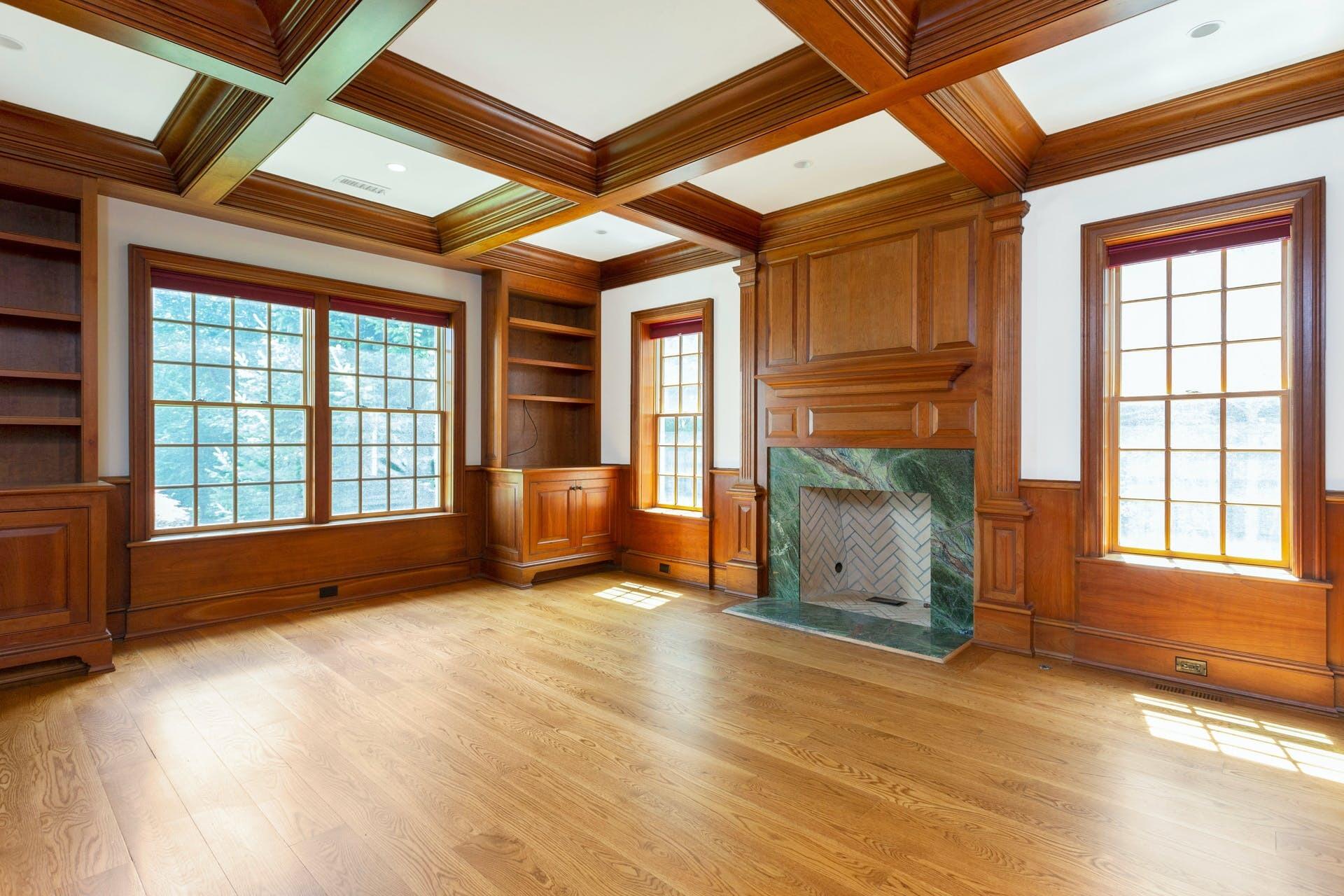 274 Mariomi Road New Canaan, CT 06840 - Photo 7 of 56 a view of an empty room with a fireplace and a window