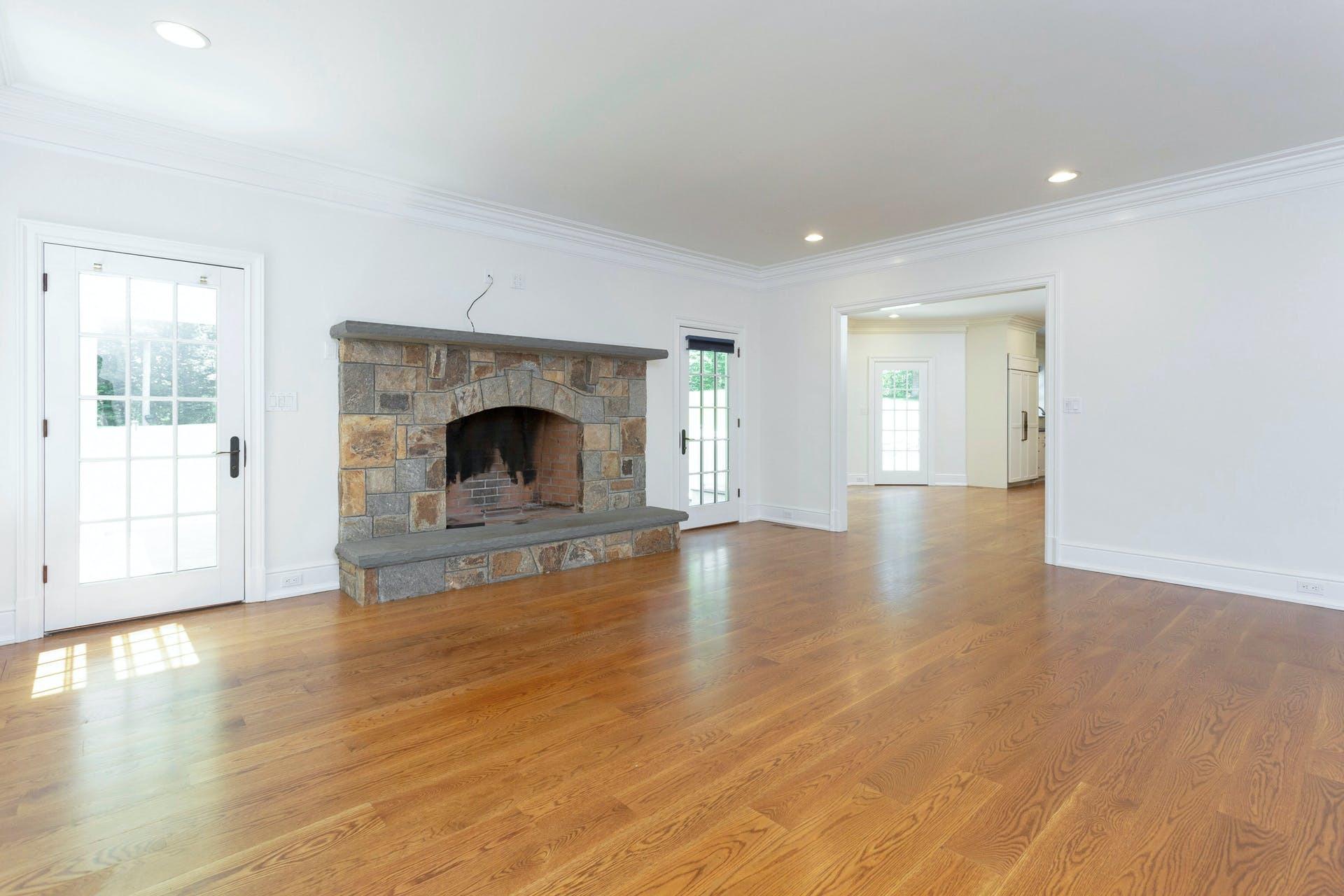274 Mariomi Road New Canaan, CT 06840 - Photo 10 of 56 a view of empty room with wooden floor and fireplace