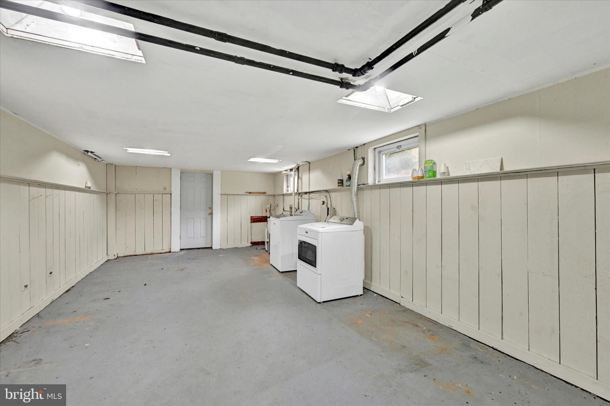 1243-10 Ten Oaks Road Baltimore, MD 21227 - Photo 23 of 28 Laundry lower level lots of storgage