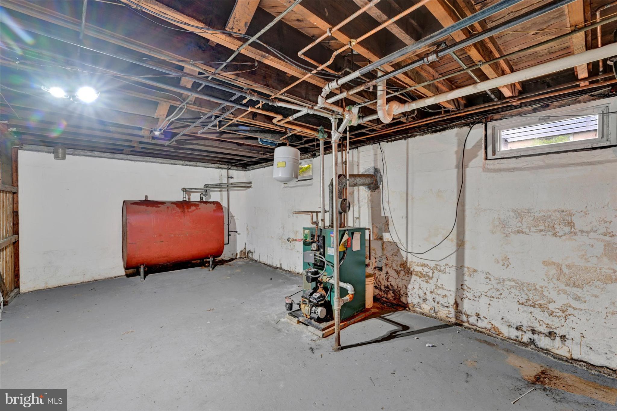 1243-10 Ten Oaks Road Baltimore, MD 21227 - Photo 24 of 28 Utility and storage in basement. Oil heat