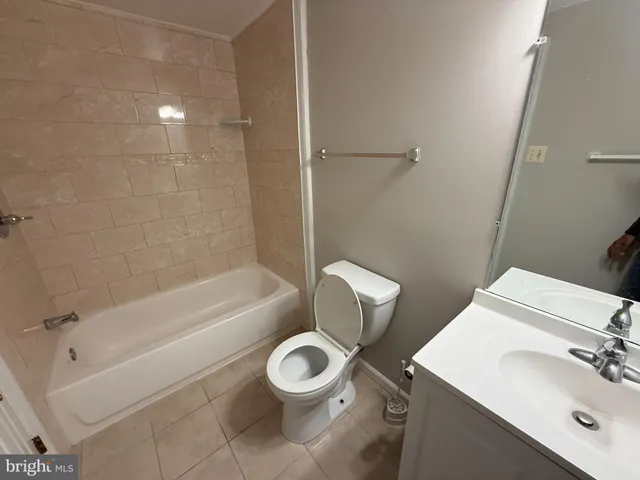 a bathroom with a sink a toilet and a bathtub