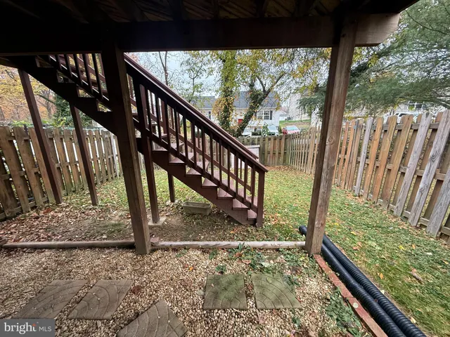 a view of a yard with wooden stairs