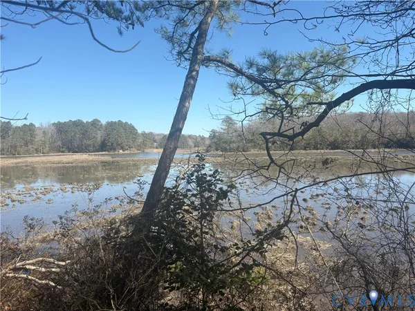 a sign on a wall next to a white wall