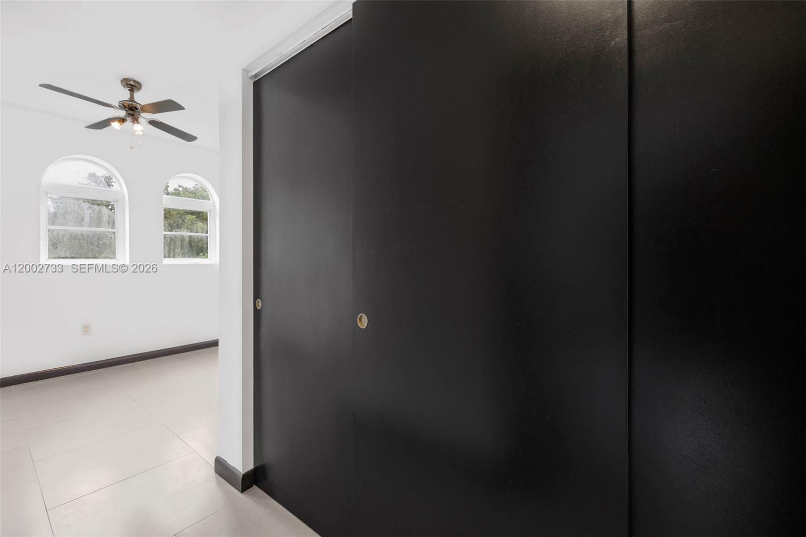 1876 Southwest 11th Terrace, Unit 302 Miami, FL 33135 - Photo 11 of 15 a view of a hallway with windows