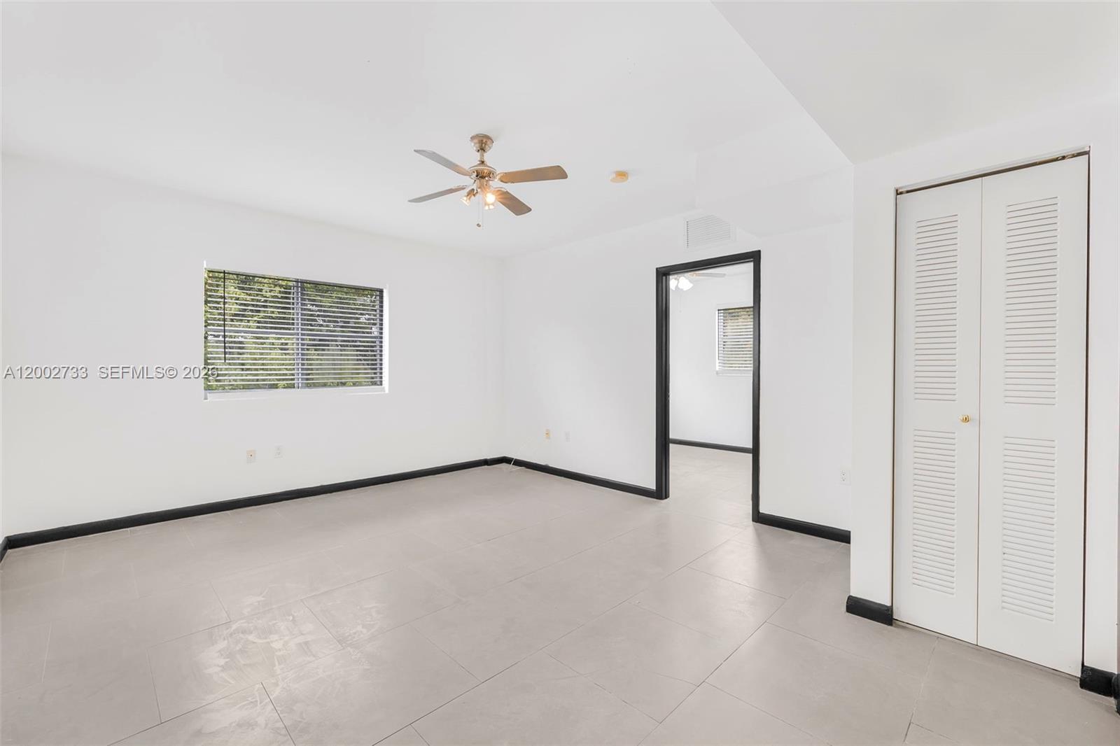 1876 Southwest 11th Terrace, Unit 302 Miami, FL 33135 - Photo 9 of 15 a view of a room with a large window