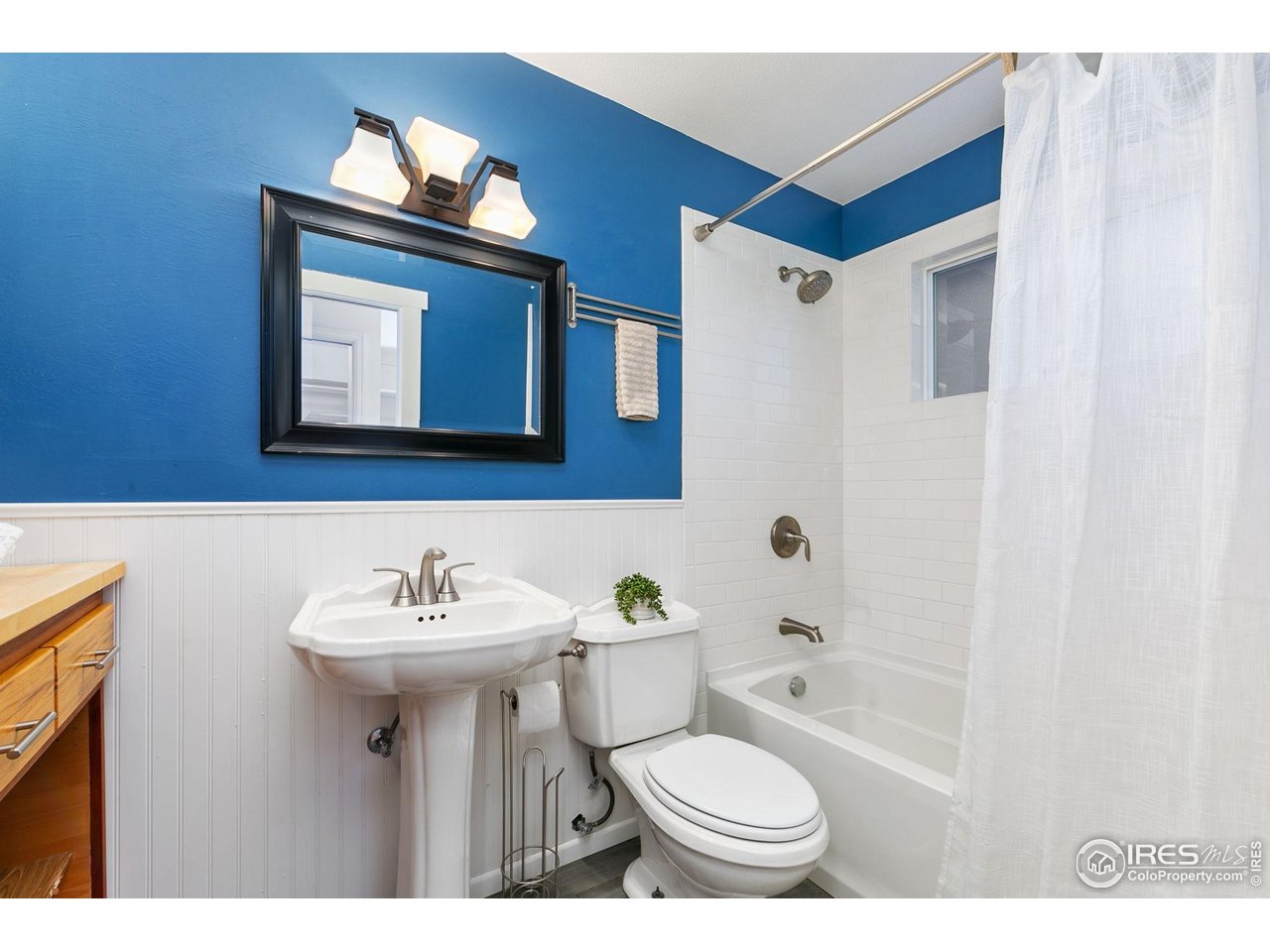 808 Tyler Street Fort Collins, CO 80521 - Photo 14 of 40 Primary en-suite has a custom vanity for extra storage which provides a convenient prep space to get ready for the day!