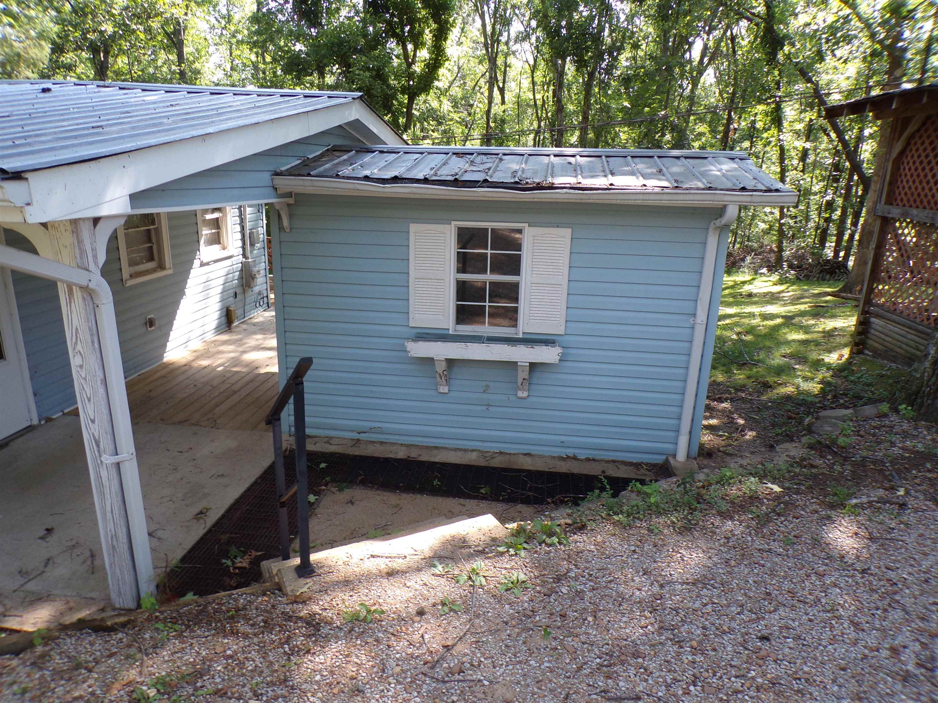 35 Cr 341 Road Iuka, MS 38852 - Photo 14 of 15 Blue siding exterior with white window shutters and a window box