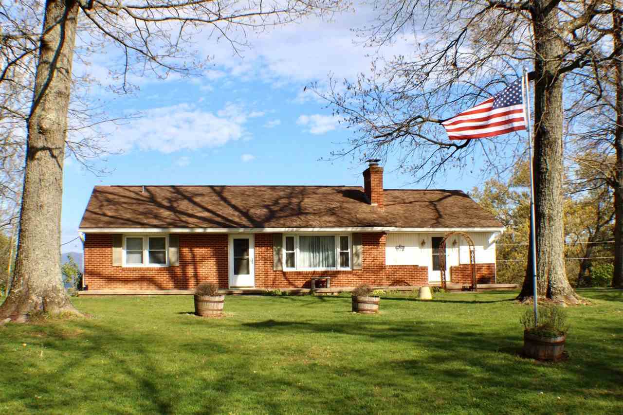 1504 Old Providence Road Raphine, VA 24472 - Photo 1 of 37 a front view of a house with a garden