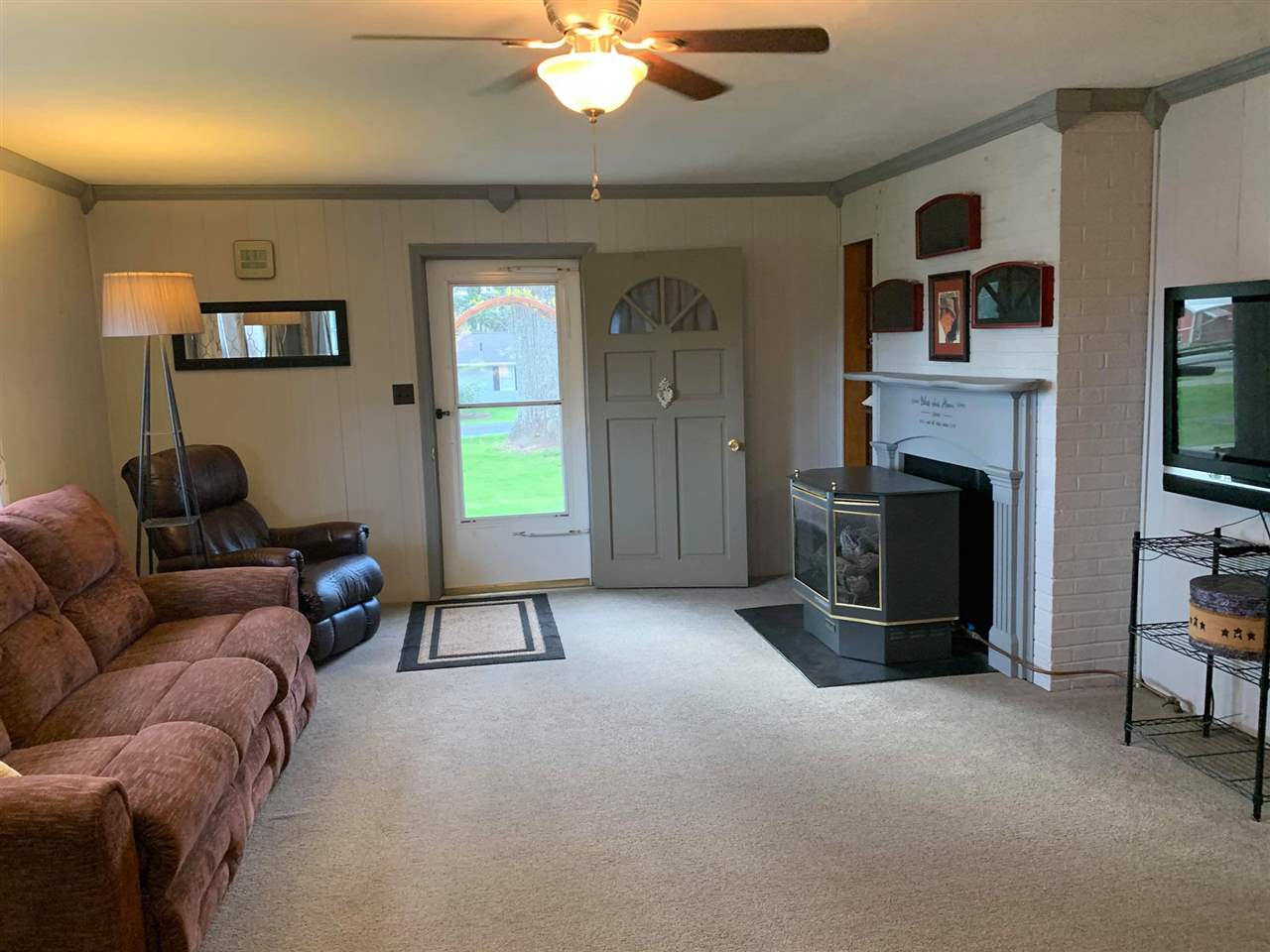 1504 Old Providence Road Raphine, VA 24472 - Photo 15 of 37 a living room with furniture and a fireplace