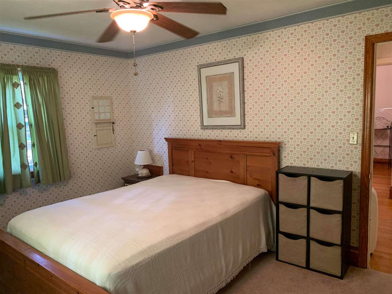 1504 Old Providence Road Raphine, VA 24472 - Photo 20 of 37 a bedroom with a bed and a chandelier