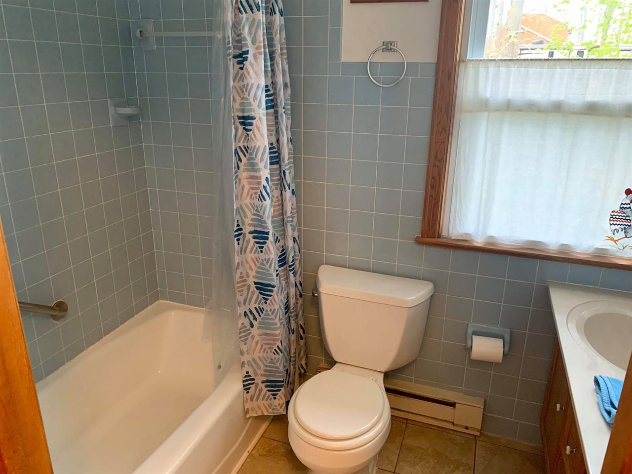 1504 Old Providence Road Raphine, VA 24472 - Photo 21 of 37 a white toilet sitting next to a bath tub