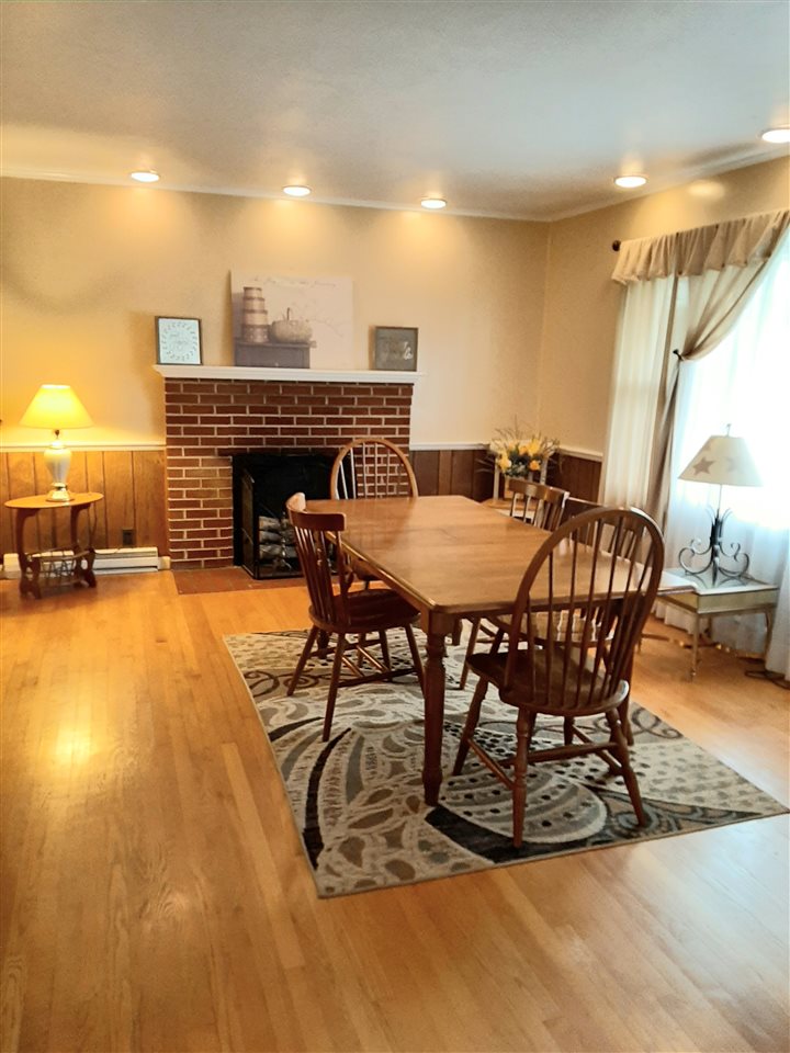 1504 Old Providence Road Raphine, VA 24472 - Photo 27 of 37 a dining room with furniture and a fireplace