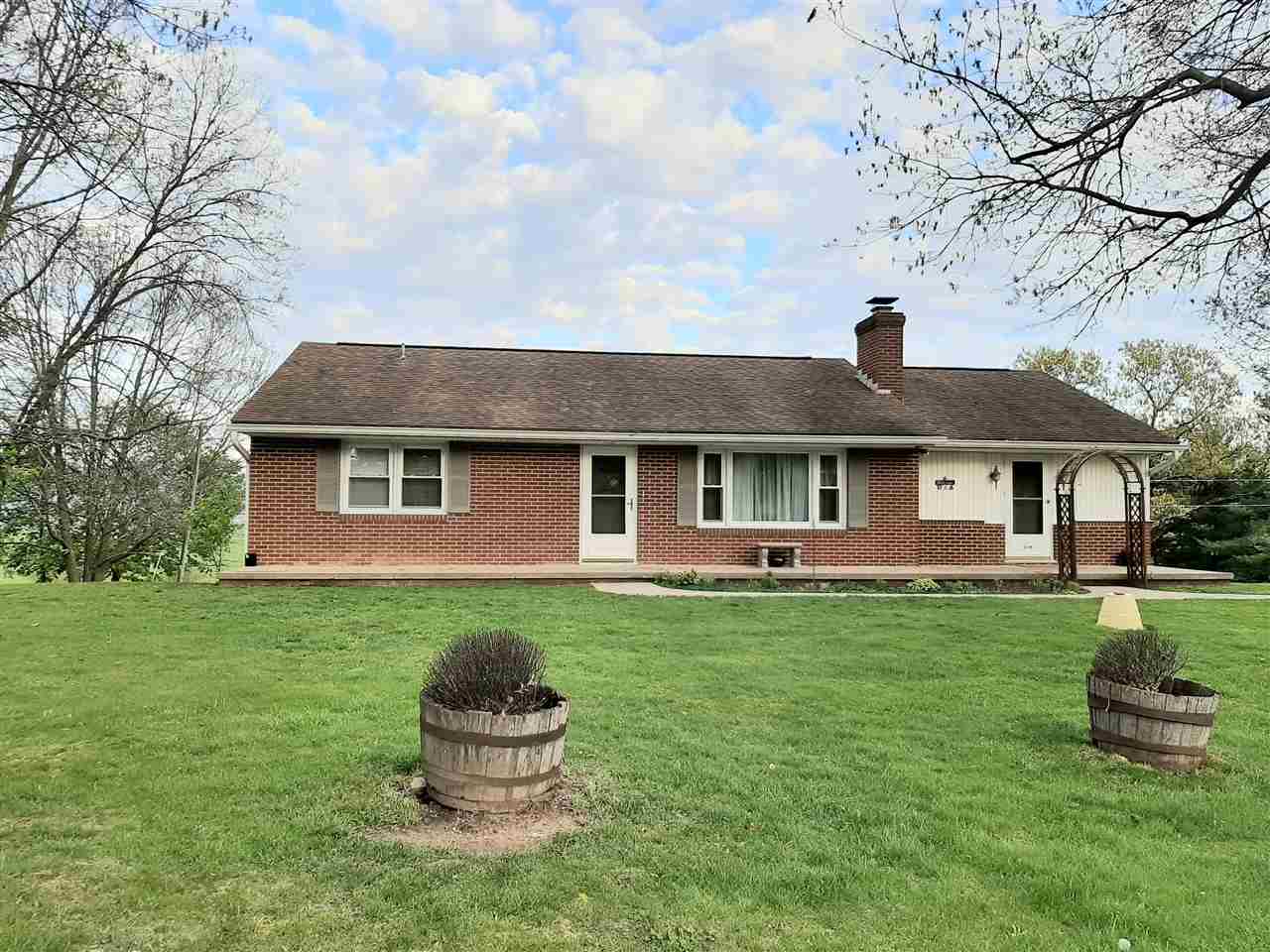 1504 Old Providence Road Raphine, VA 24472 - Photo 3 of 37 a front view of a house with a garden
