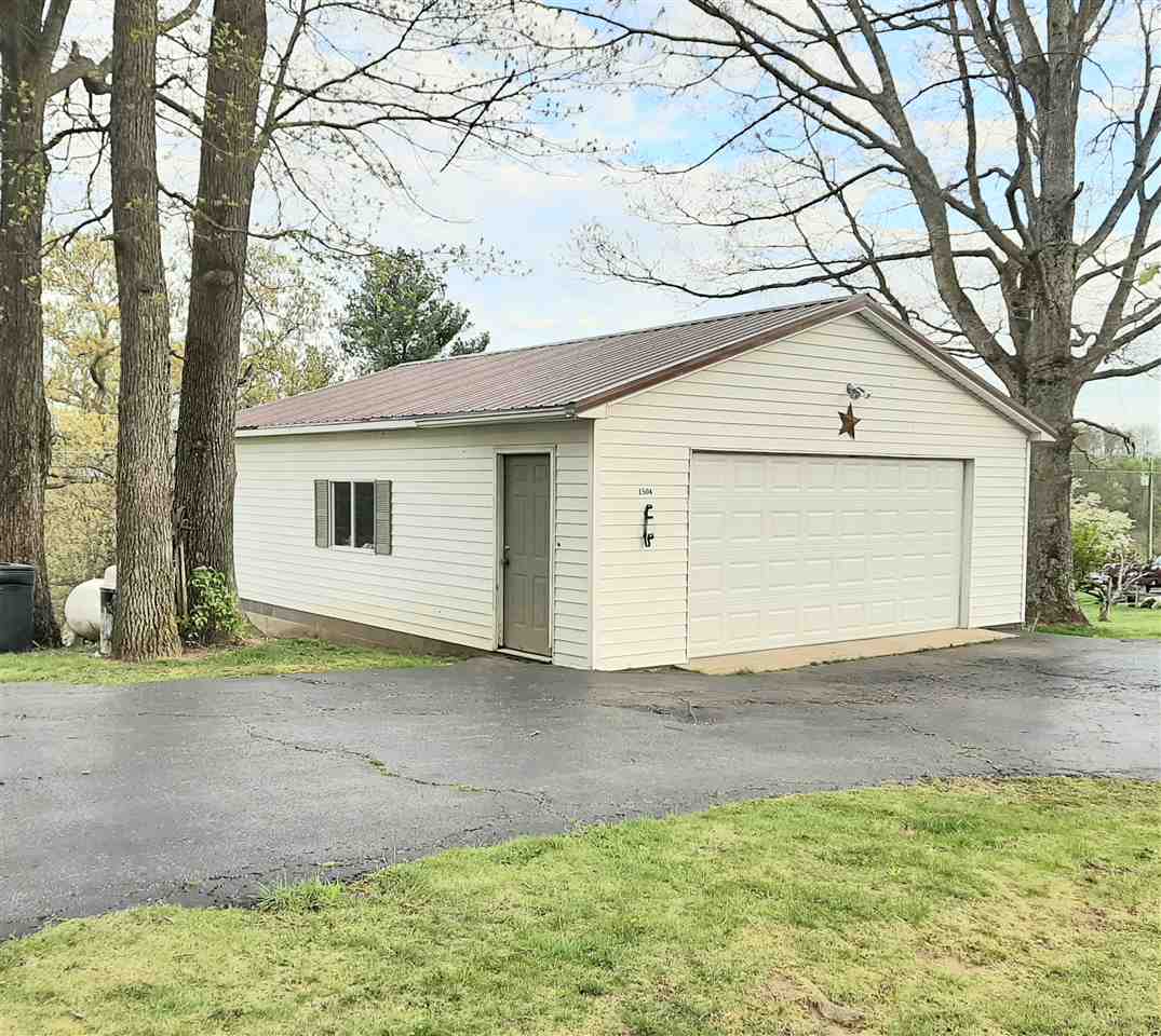 1504 Old Providence Road Raphine, VA 24472 - Photo 9 of 37 a view of a house with a yard and garage
