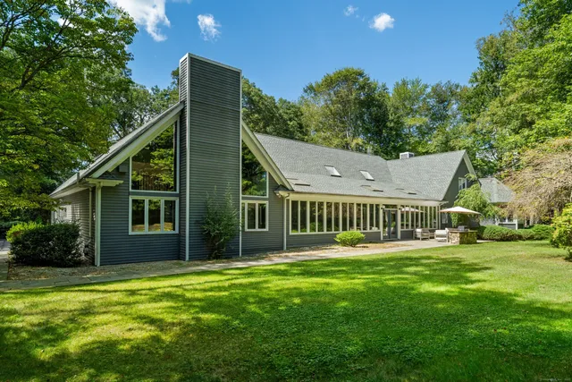 a backyard of a house with a garden and deck