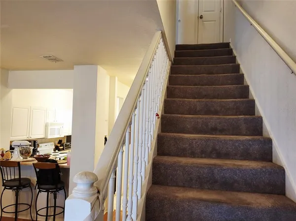 a view of hallway with stairs