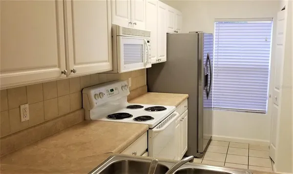 a bathroom with a sink and a washing machine