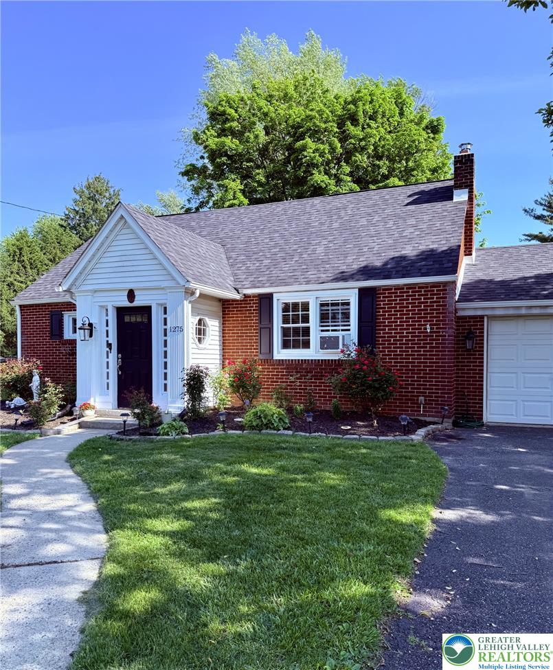 1275 Macada Road Bethlehem, PA 18017 - Photo 2 of 87 a front view of a house with a garden