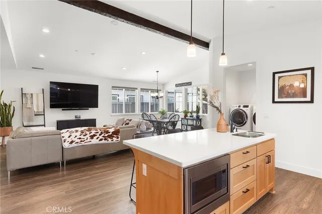a view of living room with furniture and flat screen tv