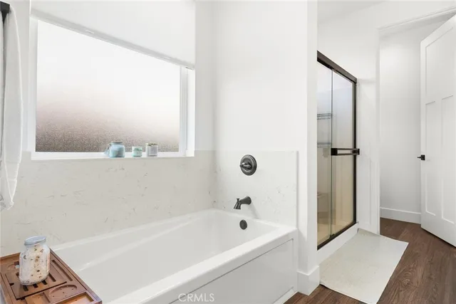 a bathroom with a bathtub and a shower