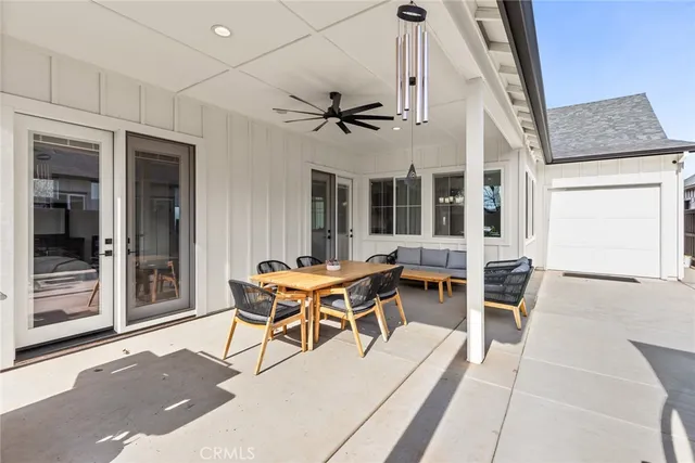 a patio with a table and chairs