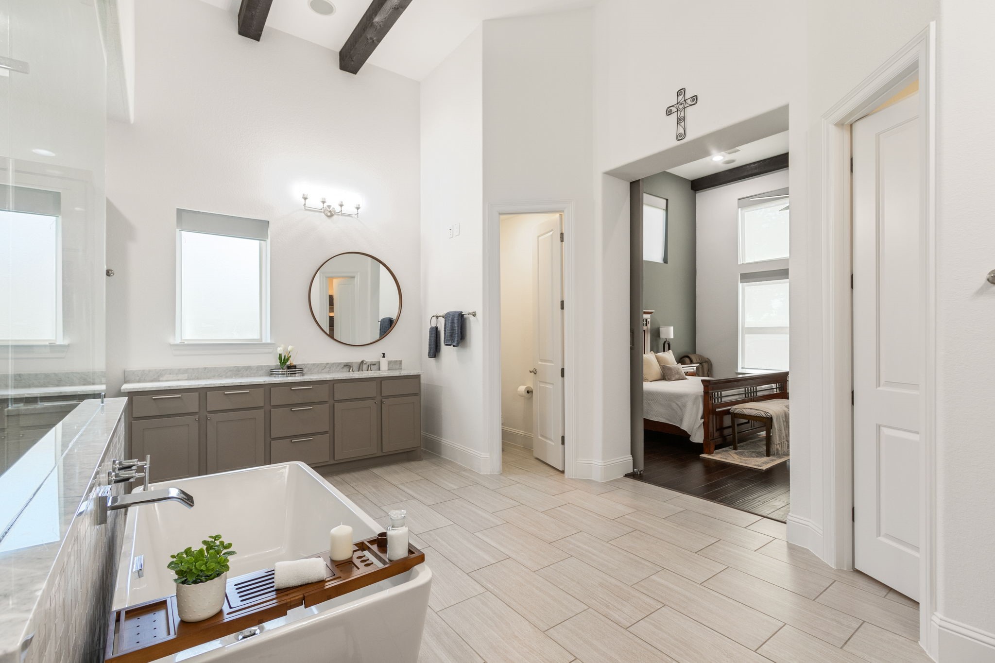 28518 Hoffman Spring Lane Fulshear, TX 77441 - Photo 25 of 50 Gorgeous spa-inspired primary bathroom with soaking tub, double vanity areas and doors to primary retreat.
