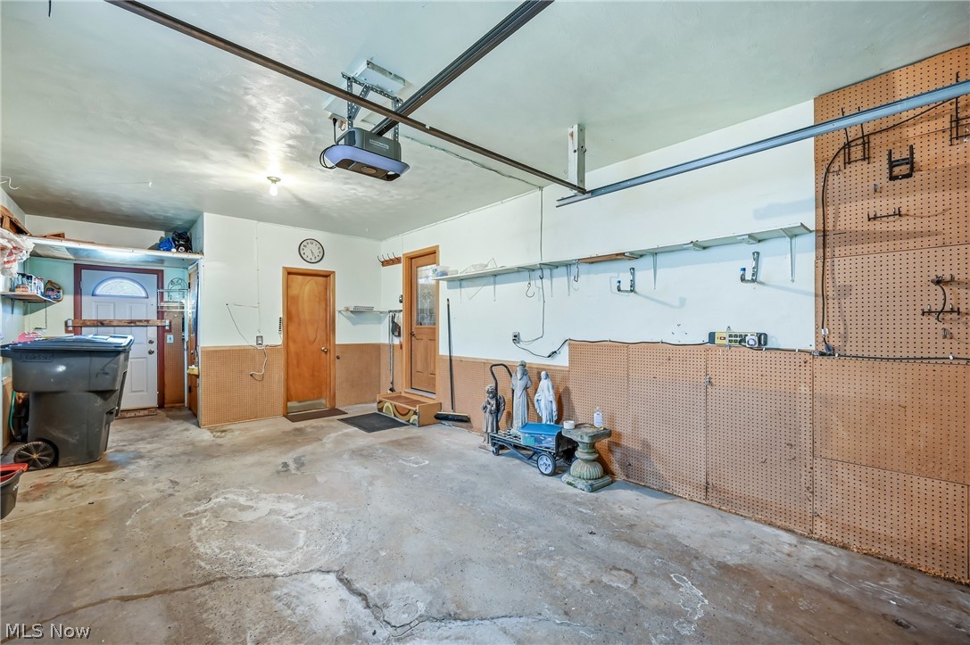 267 Butler Road Northeast Warren, OH 44483 - Photo 48 of 50 Garage with a garage door opener and a workshop area