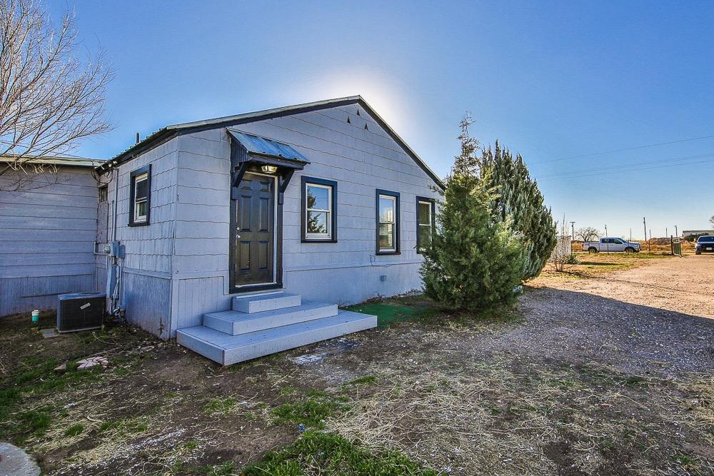 5705 County Road 1200 Lubbock, TX 79407 - Photo 1 of 29 a view of a house with a yard