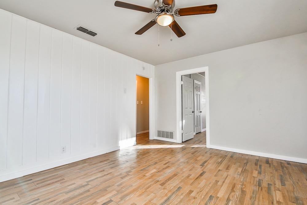 5705 County Road 1200 Lubbock, TX 79407 - Photo 11 of 29 wooden floor in an empty room
