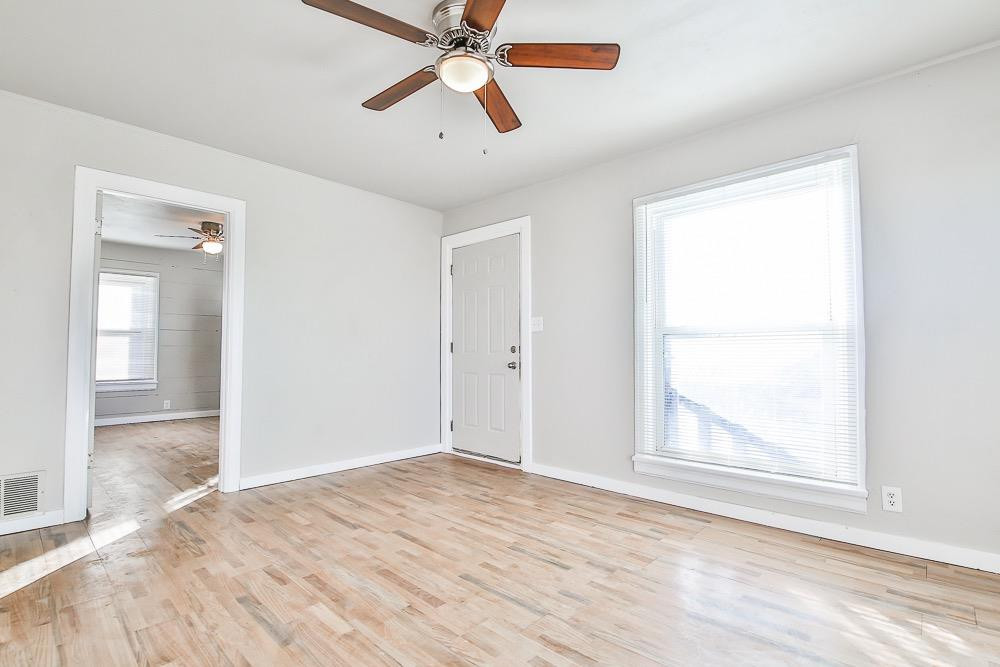 5705 County Road 1200 Lubbock, TX 79407 - Photo 12 of 29 an empty room with window and a ceiling fan