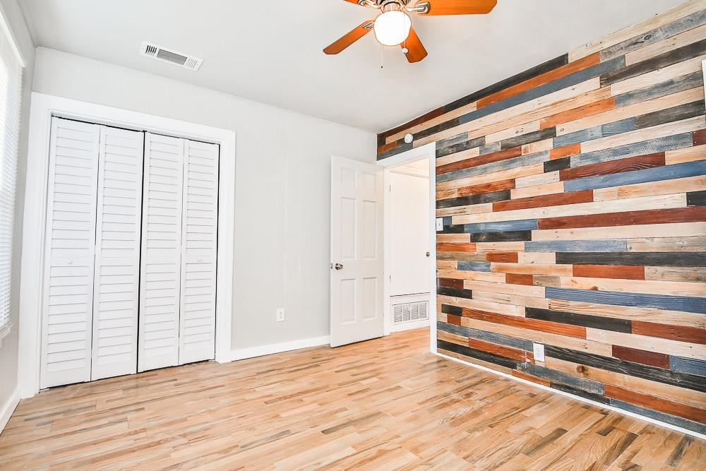 5705 County Road 1200 Lubbock, TX 79407 - Photo 18 of 29 a view of room with wooden floor and a window