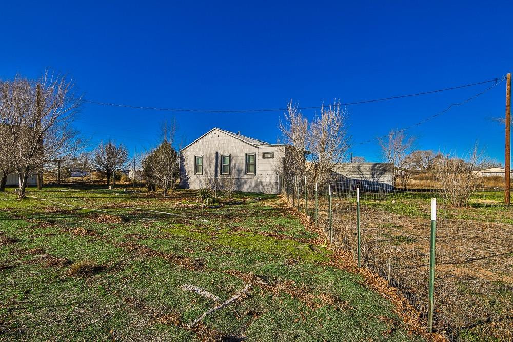 5705 County Road 1200 Lubbock, TX 79407 - Photo 8 of 29 a view of a house with a yard
