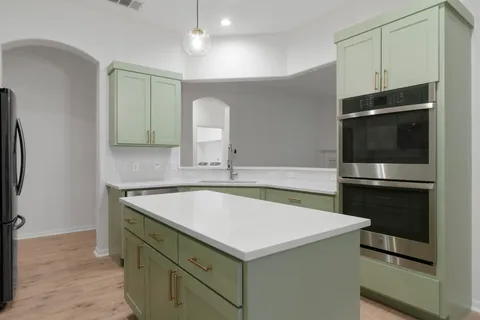 a bathroom with a sink and a microwave