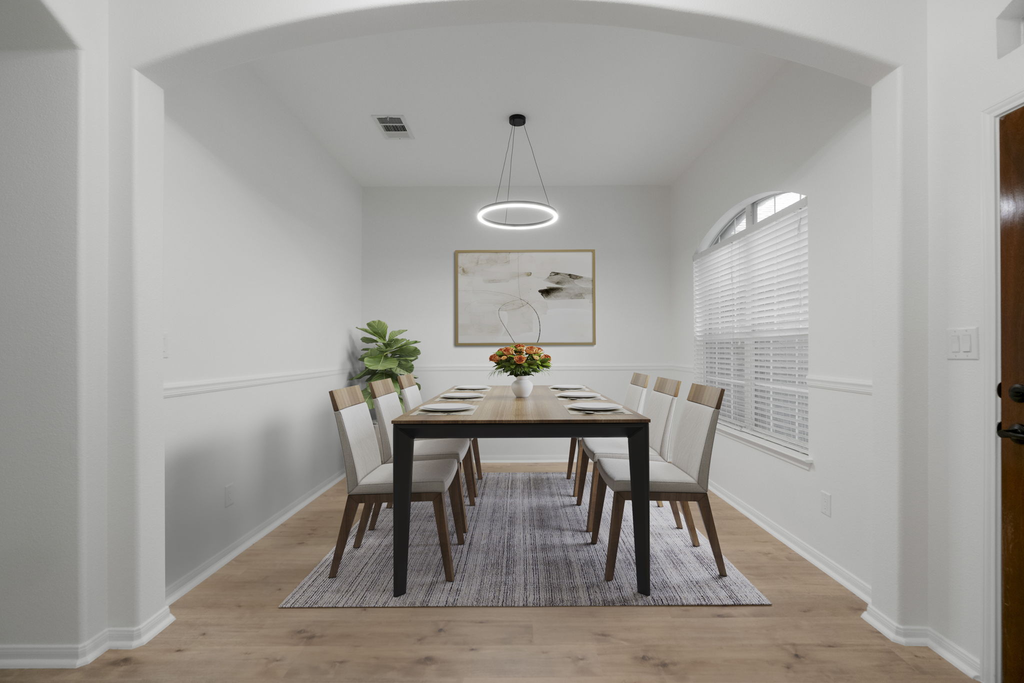 1333 Clary Sage Loop Round Rock, TX 78665 - Photo 14 of 34 Dining room featuring light wood-type flooring and arched walkways