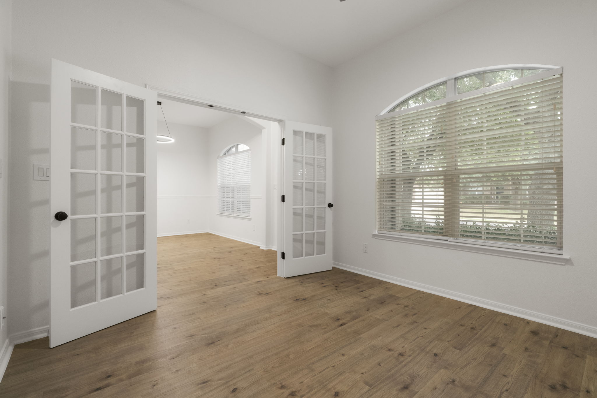 1333 Clary Sage Loop Round Rock, TX 78665 - Photo 16 of 34 Spare room featuring dark wood-type flooring and french doors