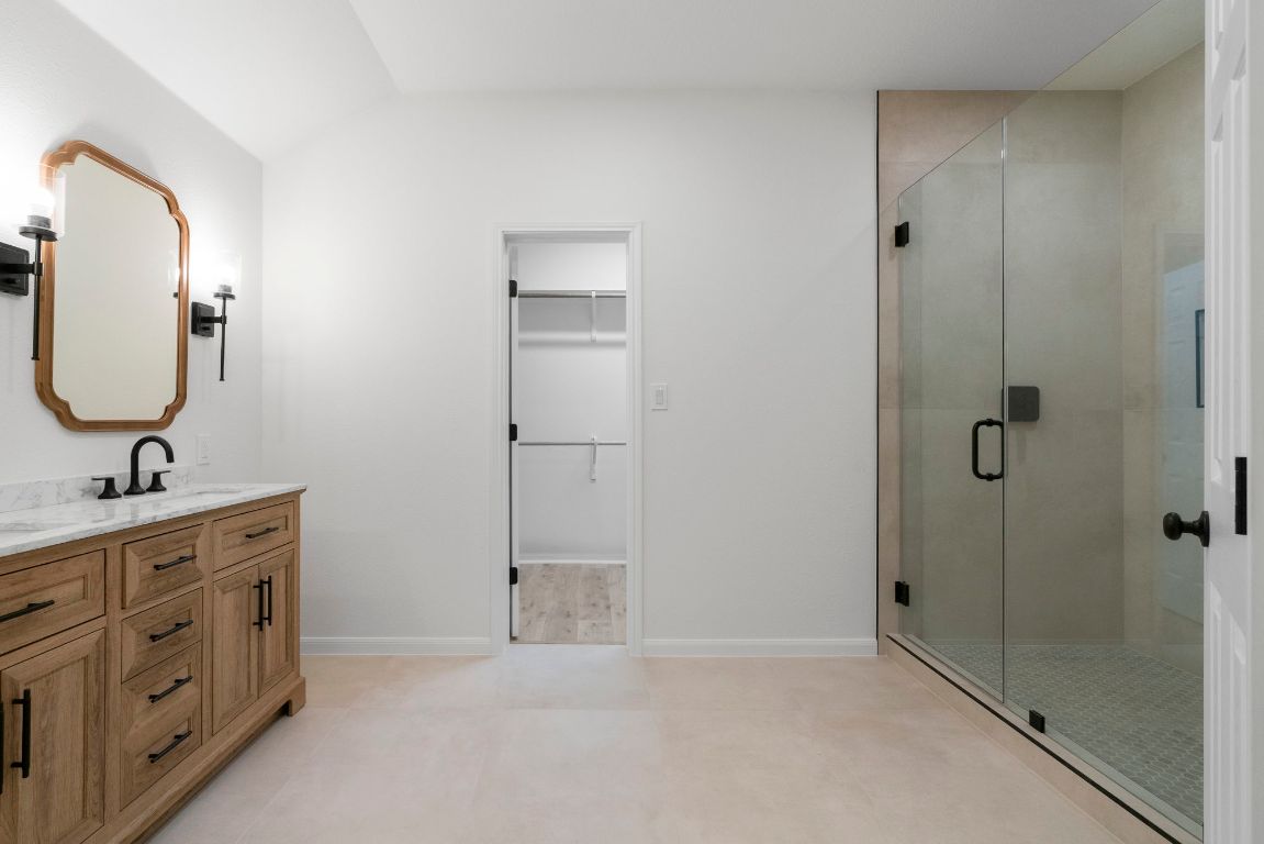 1333 Clary Sage Loop Round Rock, TX 78665 - Photo 20 of 35 a bathroom with a double vanity sink mirror and shower