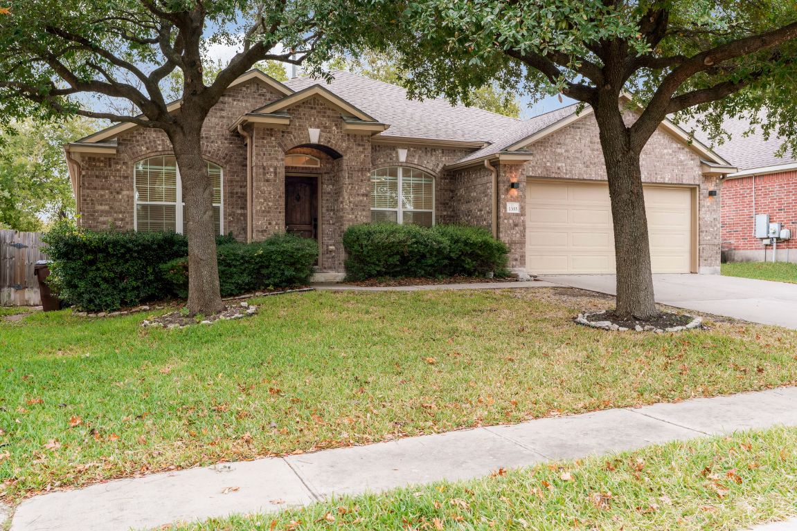 1333 Clary Sage Loop Round Rock, TX 78665 - Photo 2 of 35 a front view of a house with garden