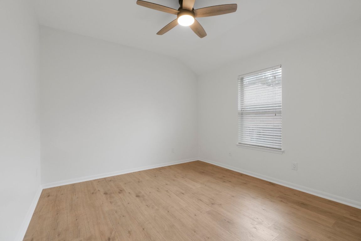1333 Clary Sage Loop Round Rock, TX 78665 - Photo 26 of 35 an empty room with a window and a ceiling fan