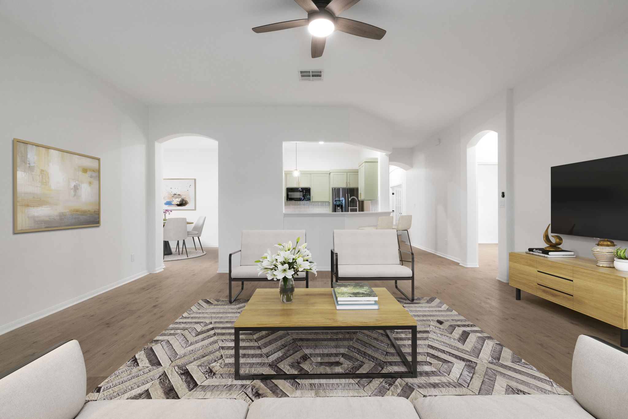 1333 Clary Sage Loop Round Rock, TX 78665 - Photo 5 of 34 Living area featuring arched walkways, ceiling fan, and wood finished floors